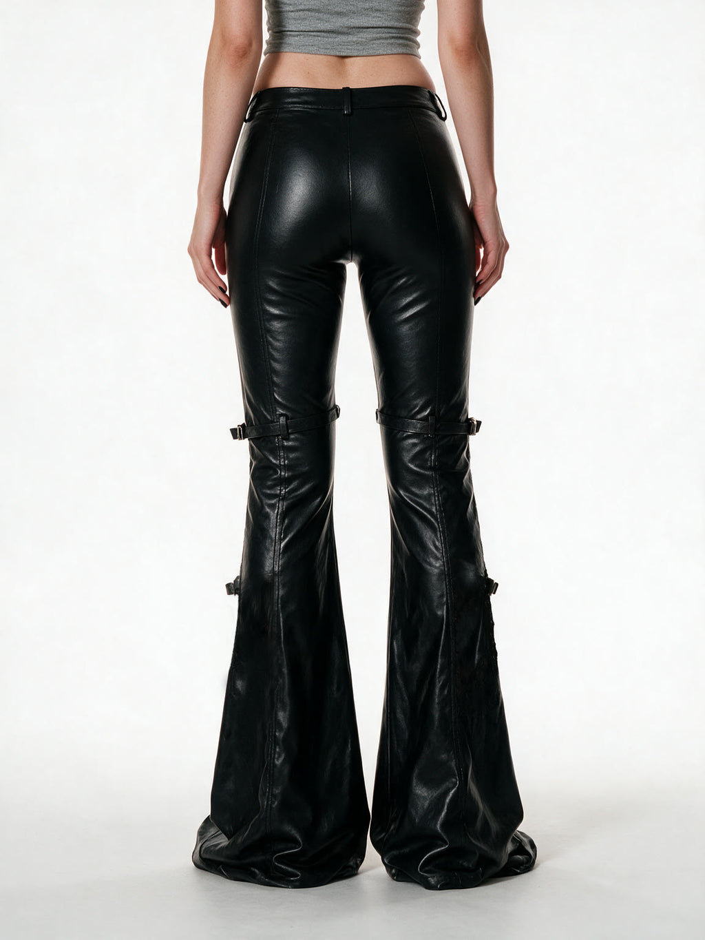 Black faux leather flare trousers with knee buckle straps