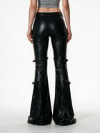 Black faux leather flare trousers with knee buckle straps