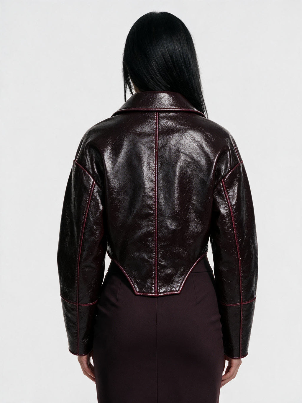 Oxblood red leather jacket with a wide lapel collar