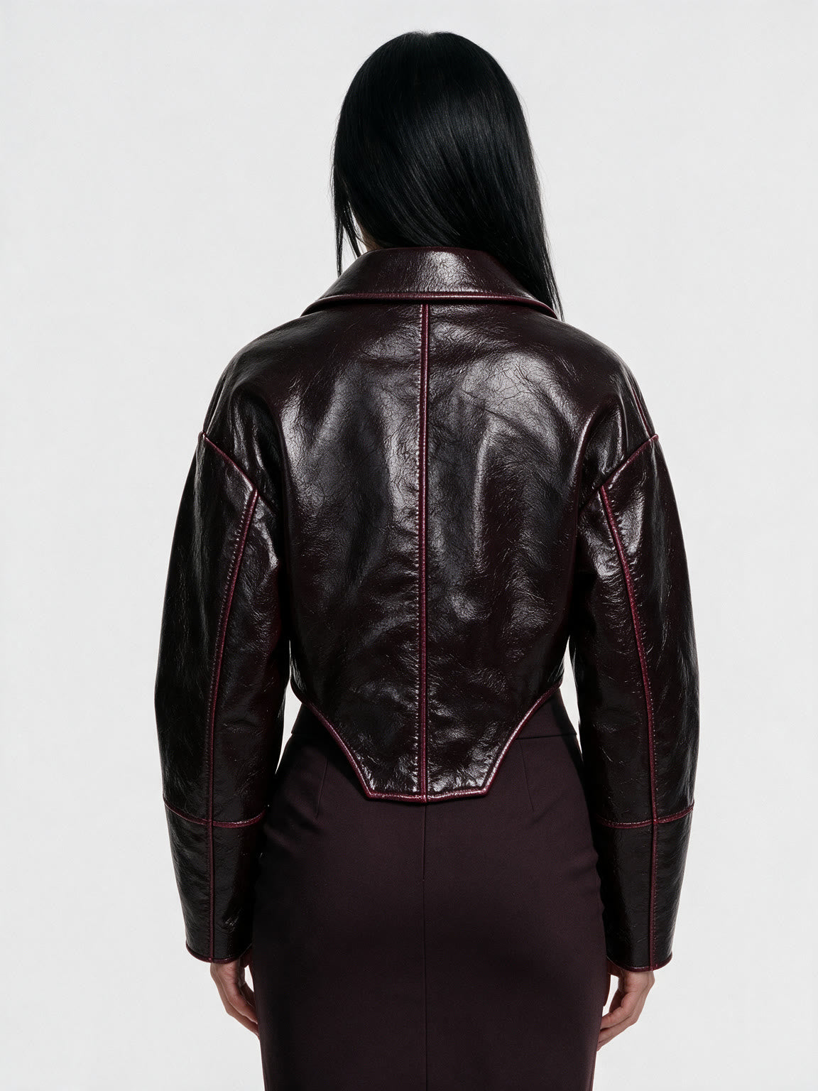 Oxblood red leather jacket with a wide lapel collar