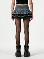 Washed denim tiered mini skirt with black lace trim