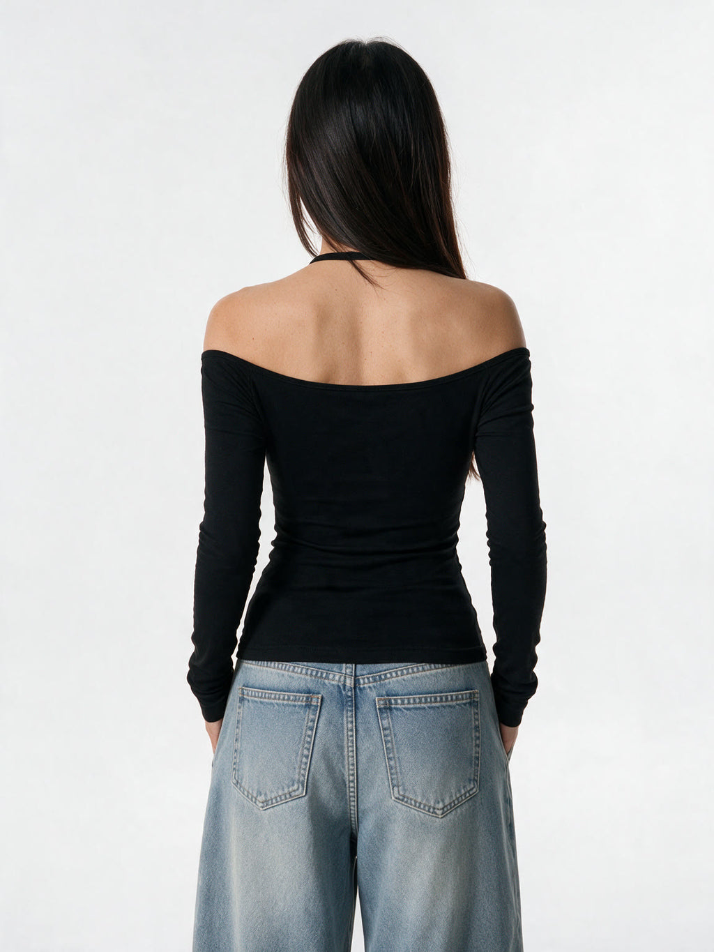 Black long sleeve top with a pinned lace panel and cross prints