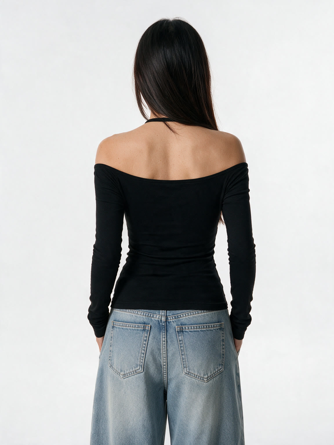 Black long sleeve top with a pinned lace panel and cross prints