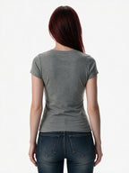 Grey baby tee with a distressed flag print