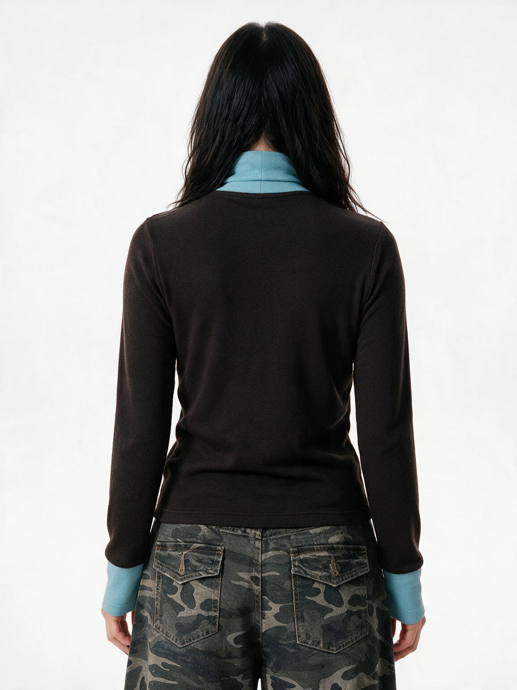 Brown turtleneck long sleeve top with pale blue cuffs