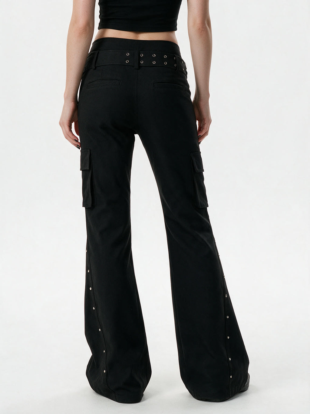 Black cargo flare trousers with rivets and a studded belt