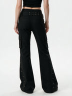 Black cargo flare trousers with rivets and a studded belt