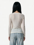 Cream long sleeve tee printed with a magazine style photo spread