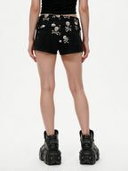 Black shorts with a skull and crossbones printed waistband