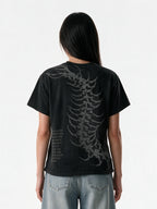Washed black oversized tee with a skeletal back print