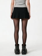 Black pleated mini skirt with silver side buttons