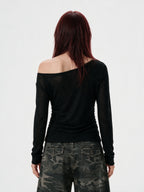 Black ruched long sleeve top printed with chains and crosses
