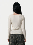 Cream fitted long sleeve baby tee with letter print