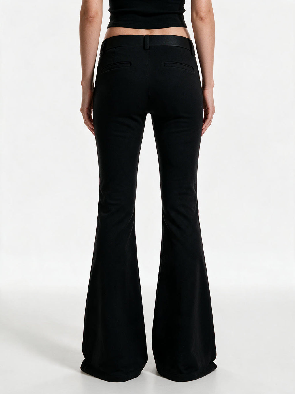Black high waist flare trousers with a studded belt