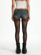 Distressed washed denim micro shorts with a lace up front