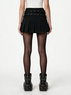 Black pleated mini skirt with two buckled eyelet belts