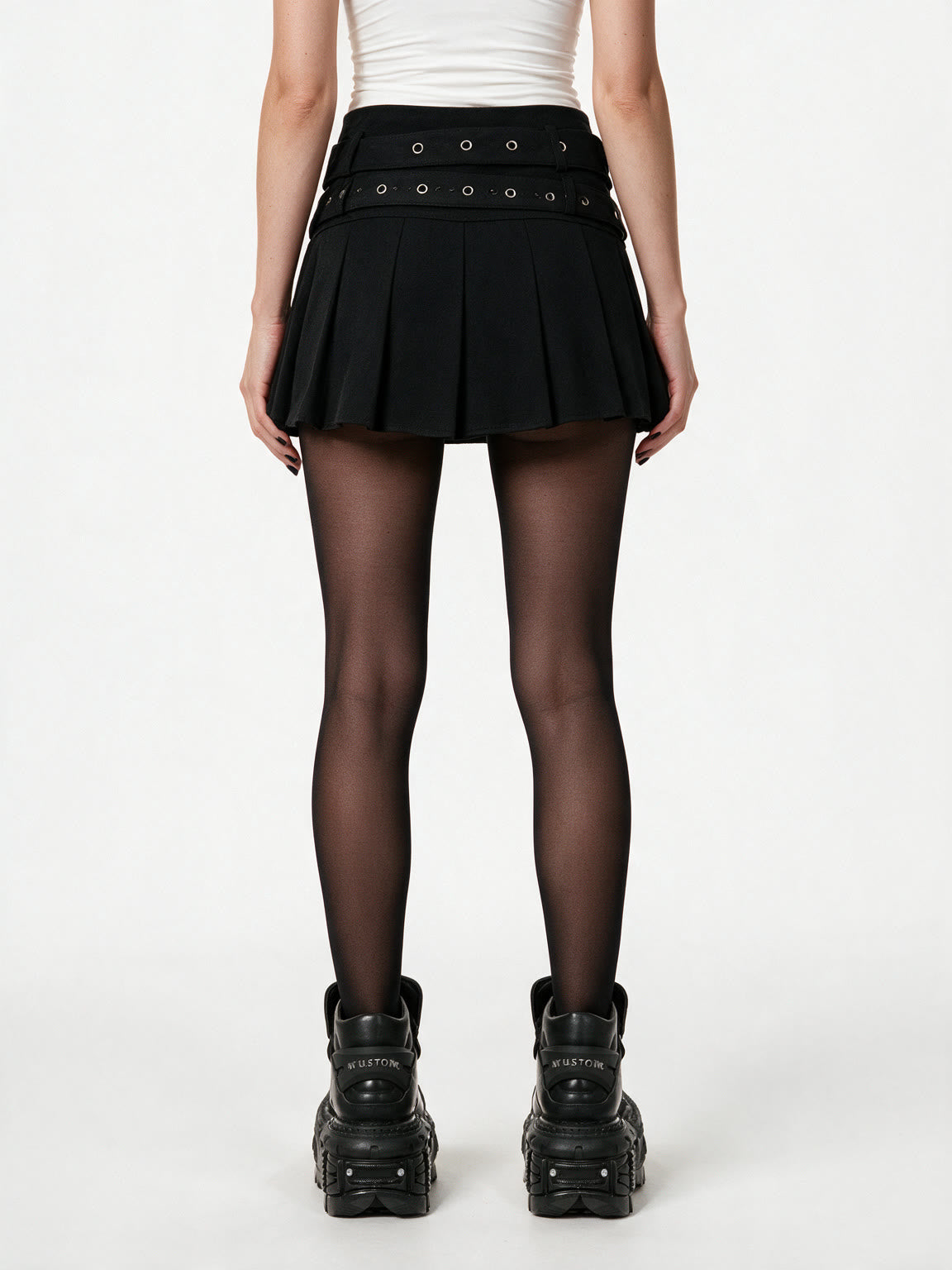 Black pleated mini skirt with two buckled eyelet belts
