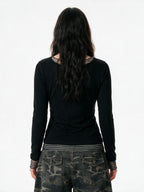 Black long sleeve top with false striped layer and tattoo print