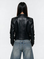 Cropped black leather moto jacket with studded shoulders