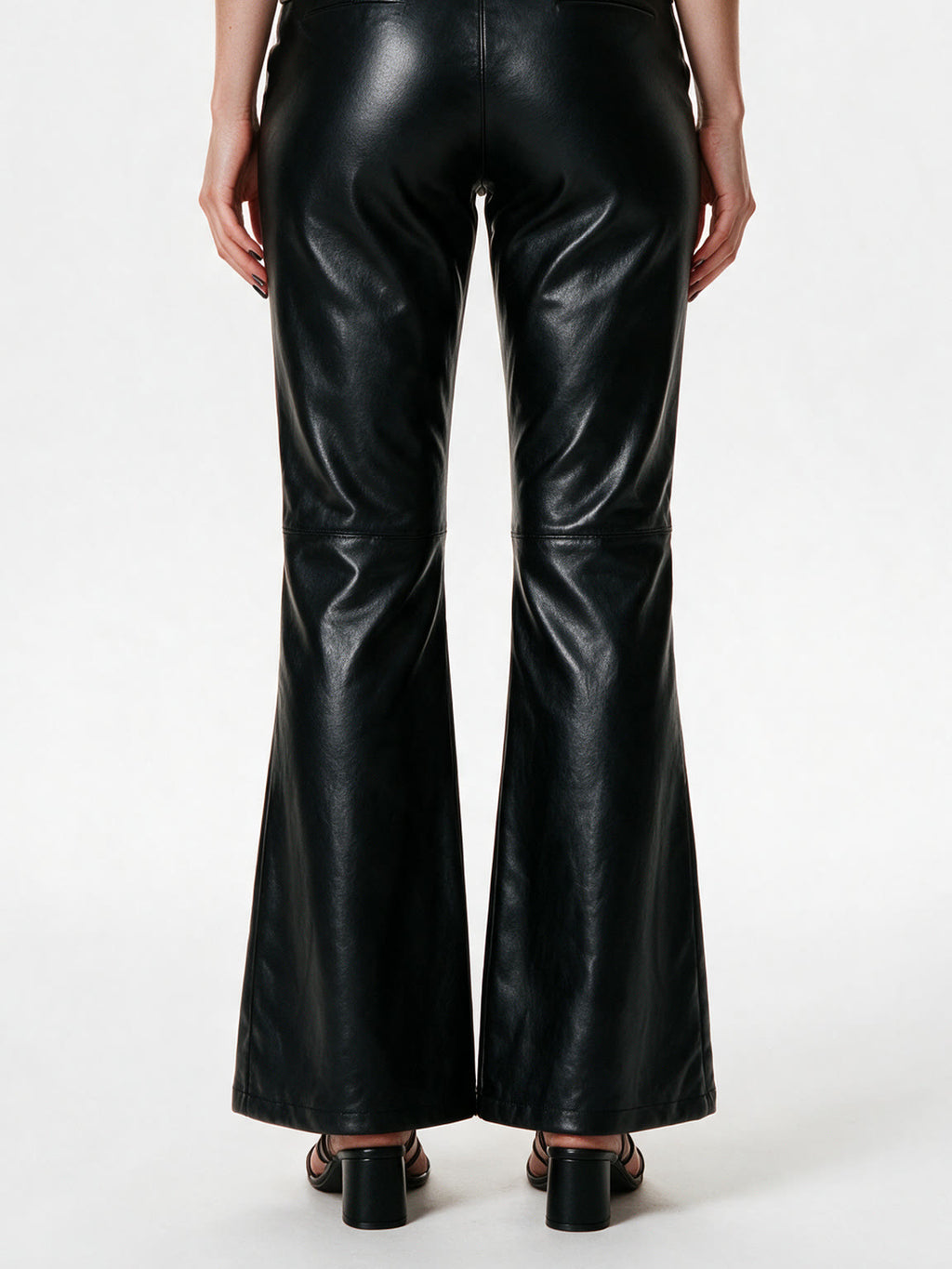 Black faux leather flare trousers with knee buckle straps