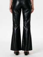 Black faux leather flare trousers with knee buckle straps