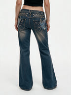 Blue bootcut jeans with crystal set back pockets