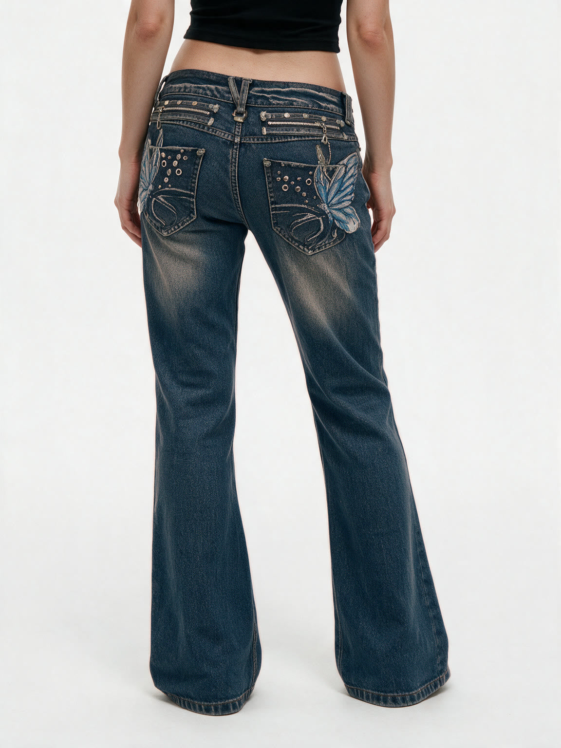 Blue bootcut jeans with crystal set back pockets