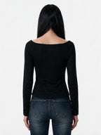 Black long sleeve top with a beaded cut out front