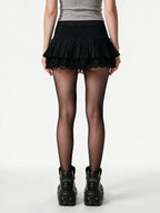 Black ruffle mini skirt with lace trim and satin bows