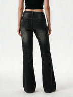 Washed black flare jeans with an asymmetric waistband