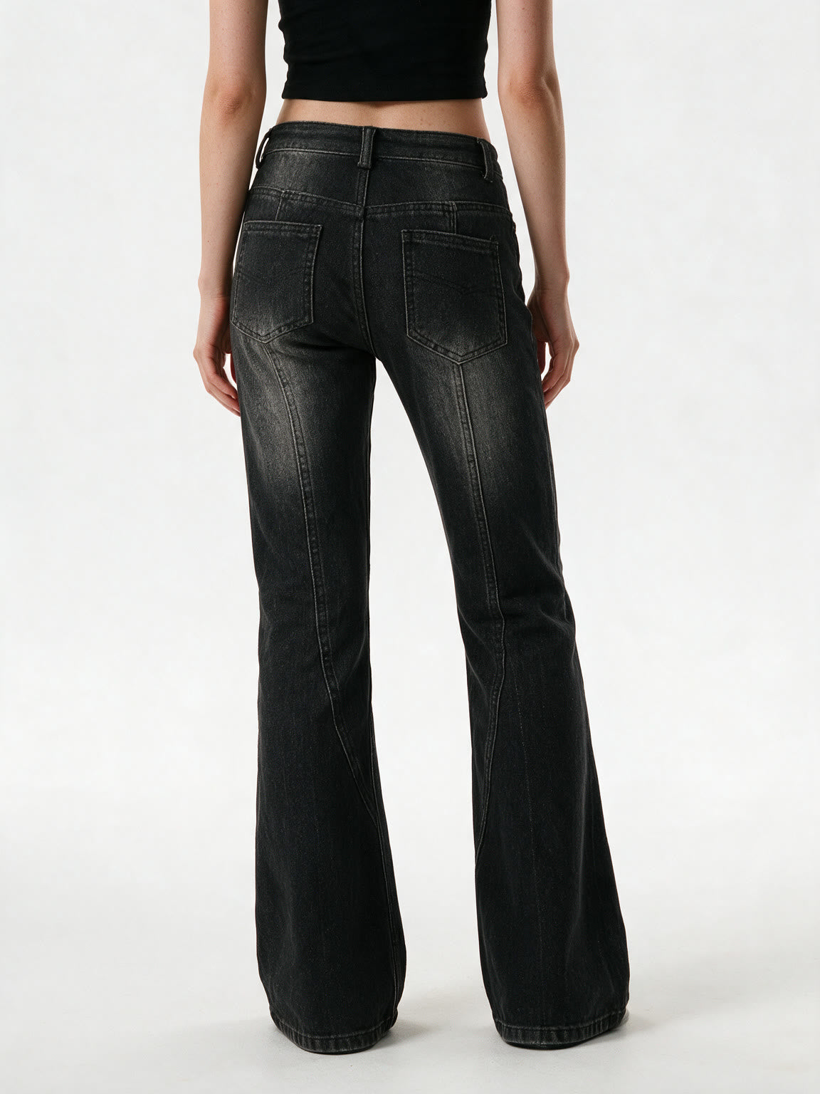 Washed black flare jeans with an asymmetric waistband