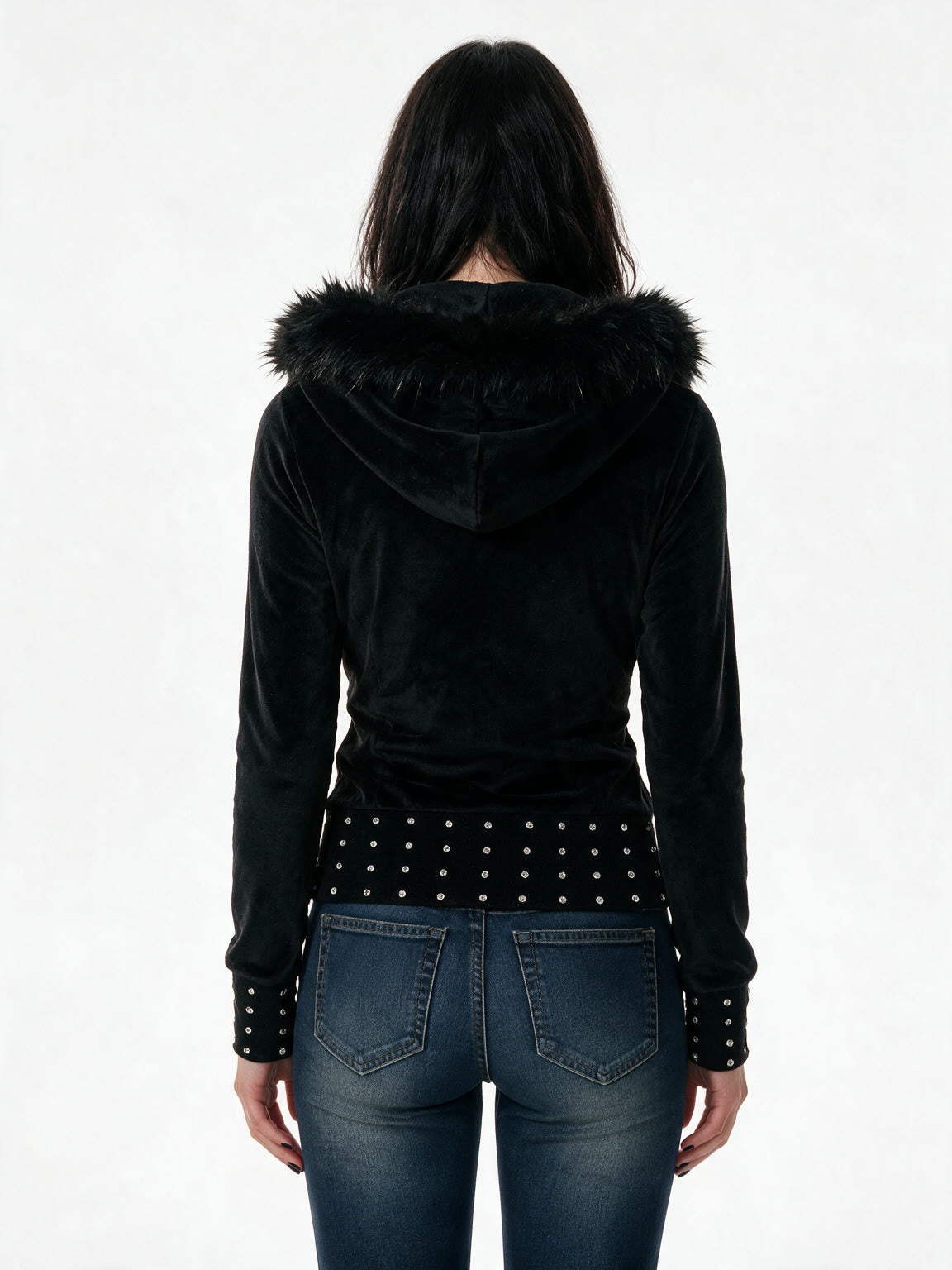 Slim black jacket with a faux fur hood and studded hem