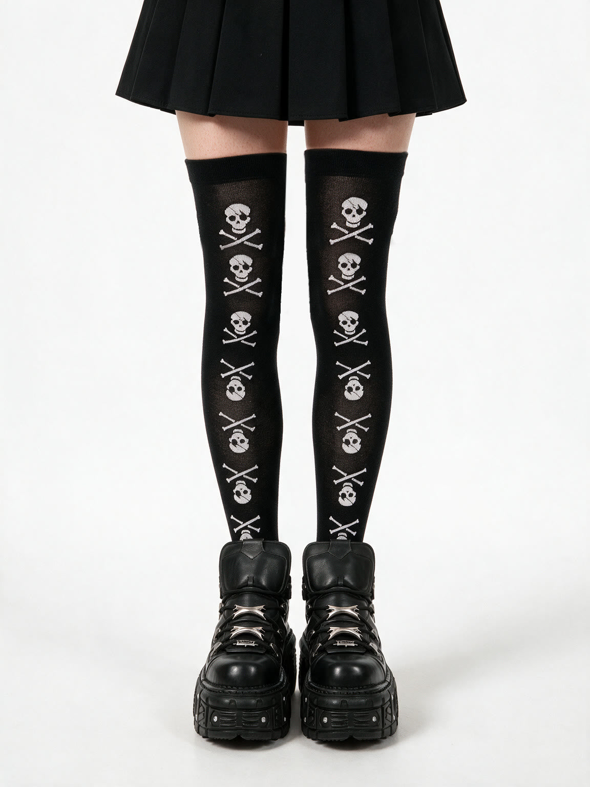 Black thigh high socks printed with white skulls and crossbones