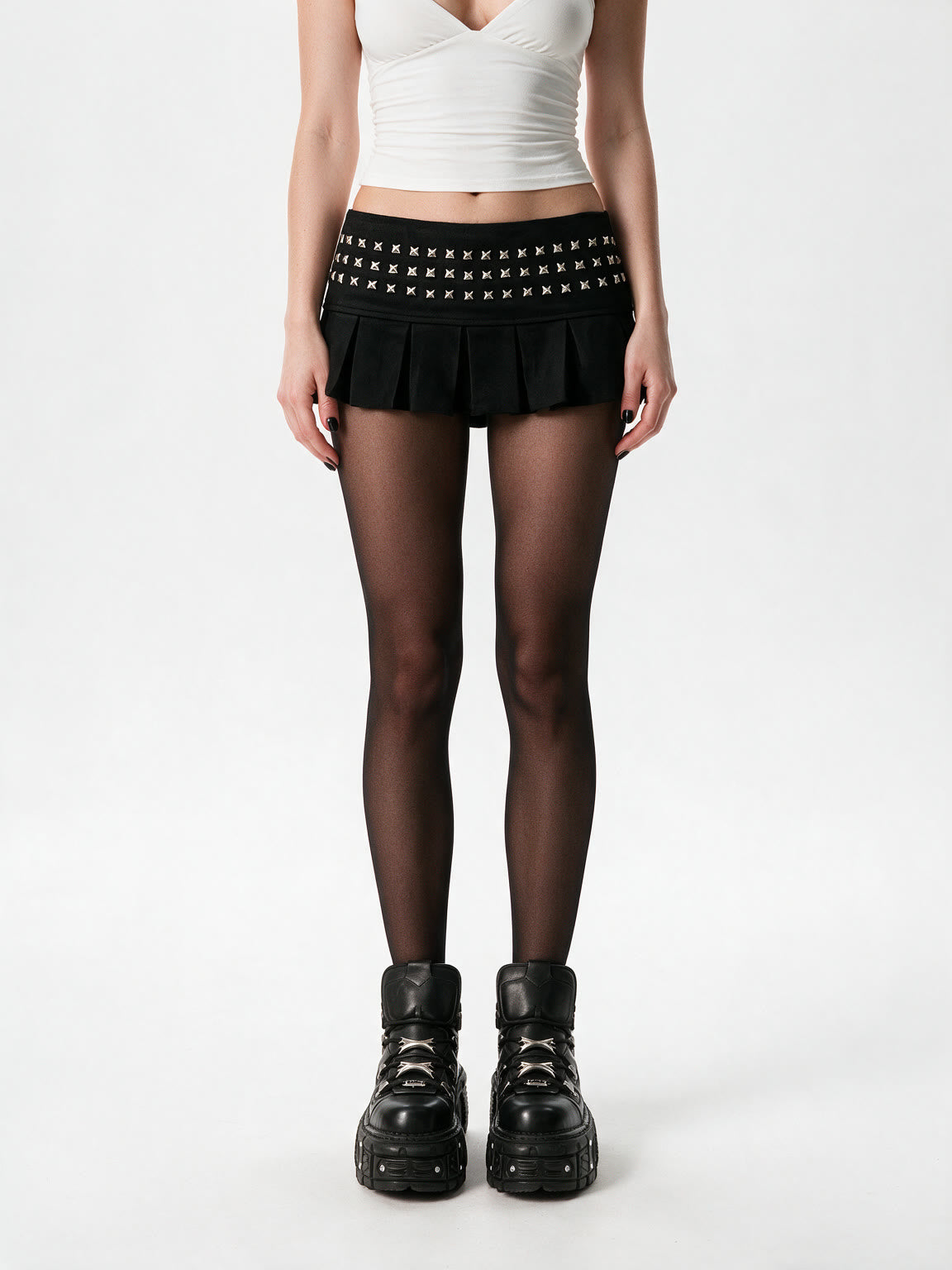 Black pleated mini skirt with a studded yoke