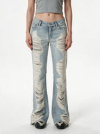 Light wash destroyed flare jeans with shredded legs