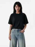 Washed black oversized tee with a skeletal back print