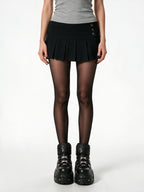 Black pleated mini skirt with silver side buttons