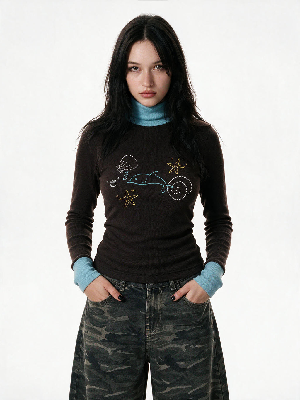 Brown turtleneck long sleeve top with pale blue cuffs