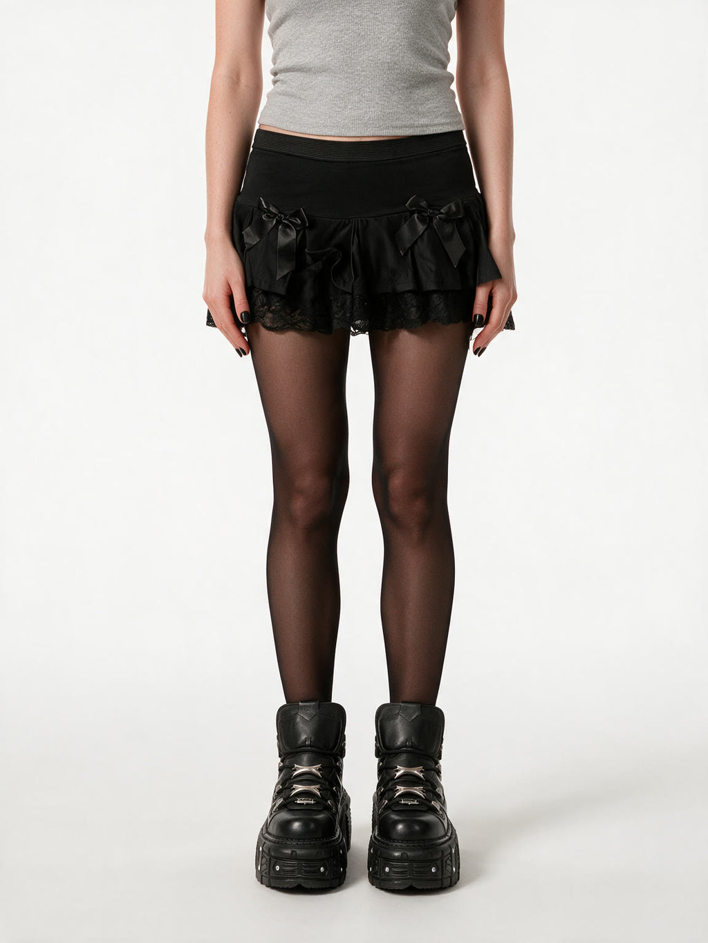 Black ruffle mini skirt with lace trim and satin bows