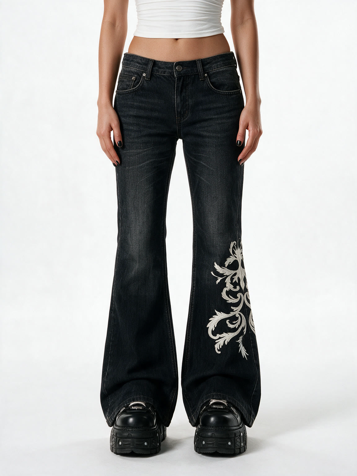 Black flare jeans with white filigree embroidery