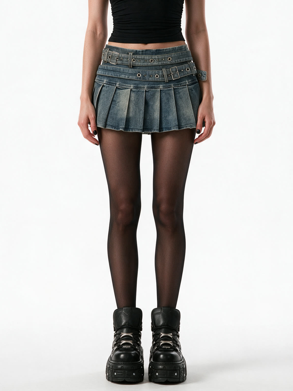 Washed denim pleated mini skirt with a riveted belt