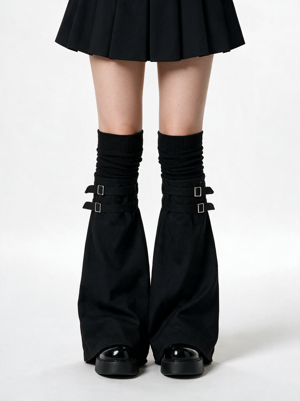 Black knit leg warmers with buckled flare panels