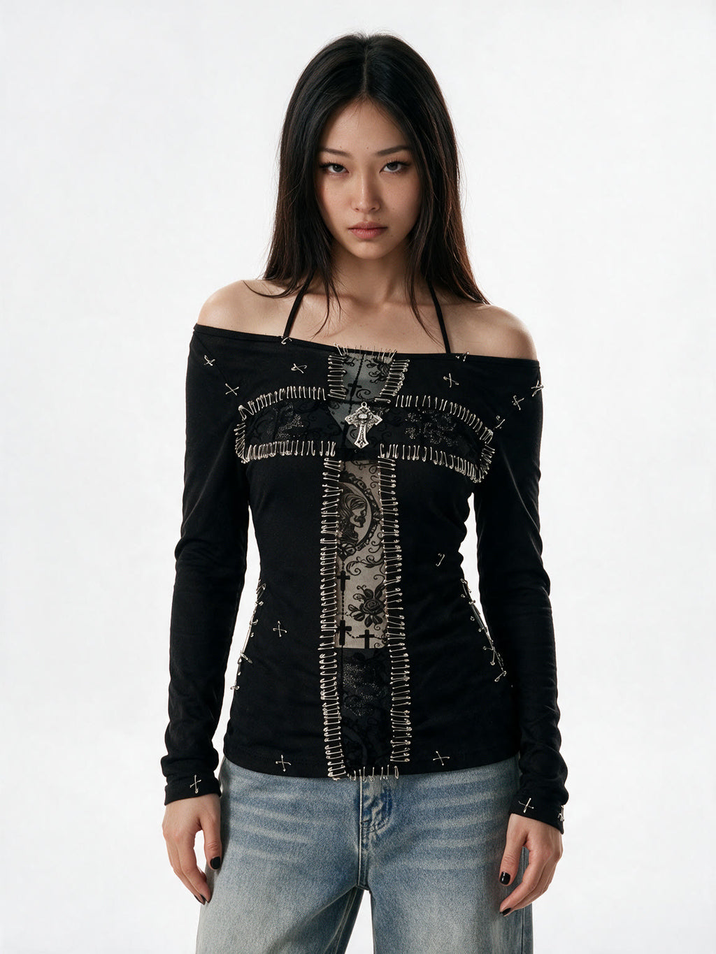 Black long sleeve top with a pinned lace panel and cross prints