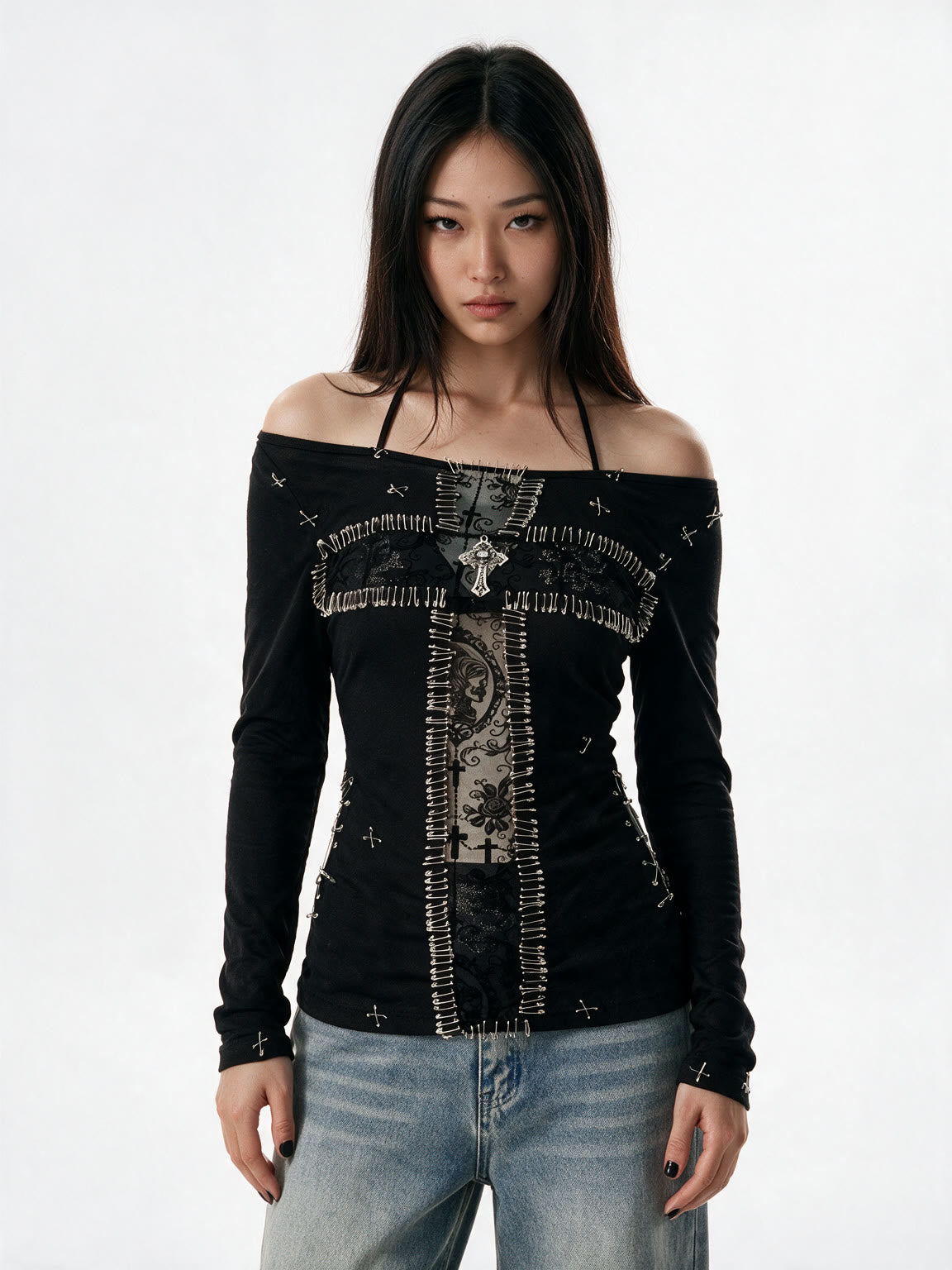 Black long sleeve top with a pinned lace panel and cross prints