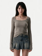 Taupe ribbed long sleeve top with an irregular hem