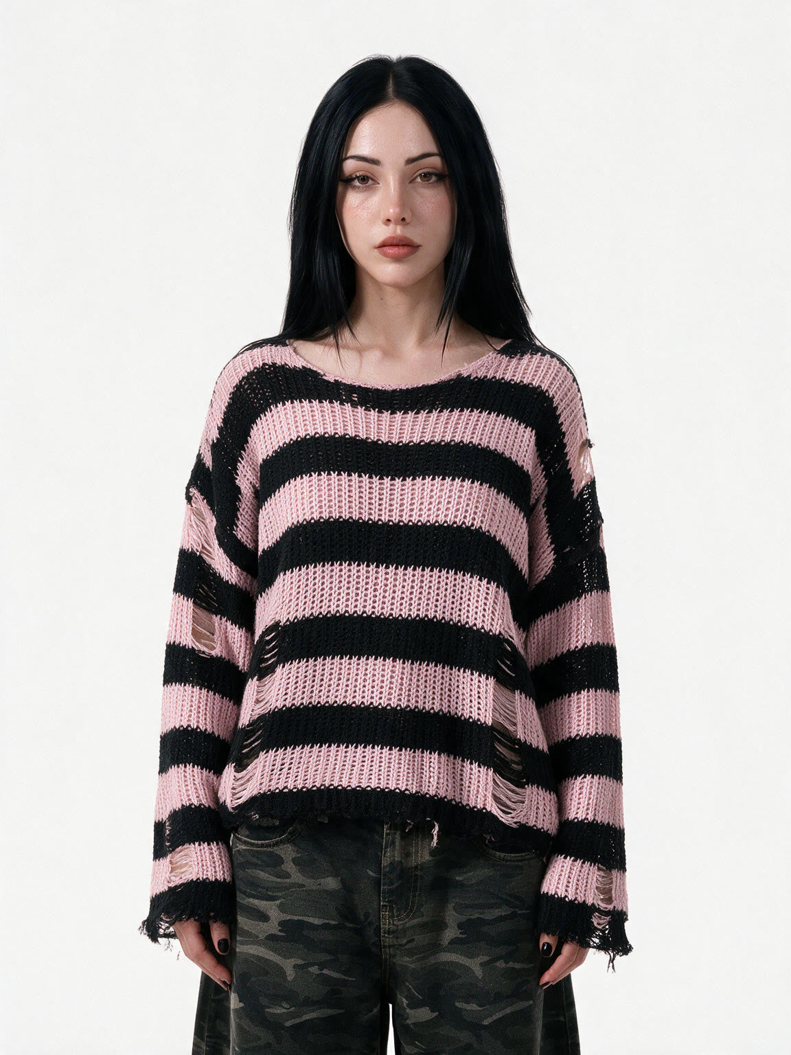 Oversized pink and black striped distressed knit sweater
