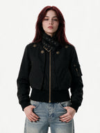 Cropped black bomber jacket with a studded buckled collar