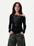 Black ruched long sleeve top printed with chains and crosses