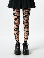 Black tights with lattice cut outs across the thighs