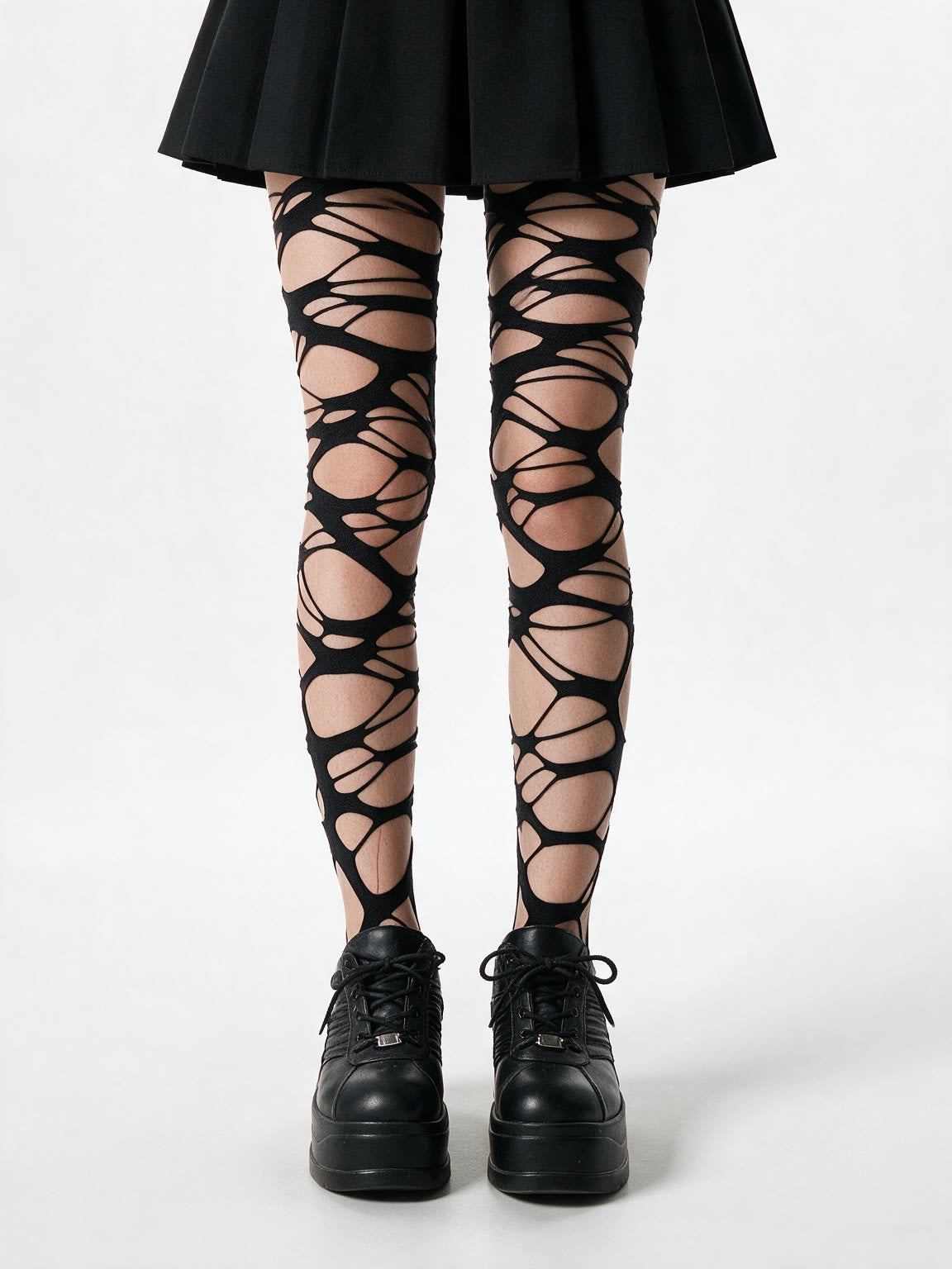 Black tights with lattice cut outs across the thighs